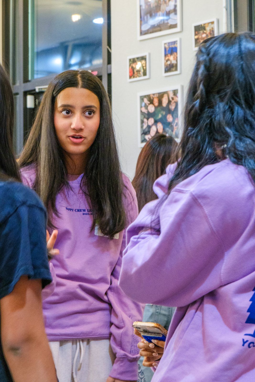 A student leader listening, mid-conversation